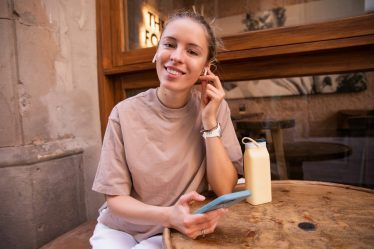 happy woman lokking her phone