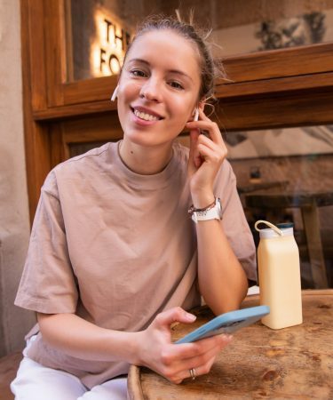 happy woman lokking her phone