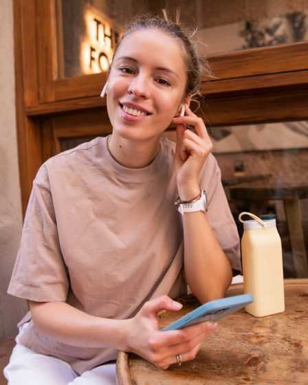 happy woman lokking her phone